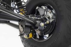 Closeup of the 2021 Bronco solid rear axle linkage, disc brake and electronic parking brake.