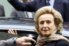 FILE- In this Nov. 24, 2011 file photo, Former French President Jacques Chirac, waving in background, and his wife Bernadette enter their car after a ceremony awarding laureates of the Fondation Chirac at Quai Branly Museum in Paris, France. French President Emmanuel Macron wants to formalize the role of the president's wife amid controversy over the cost and status of the first lady. The president's office is preparing a formal communication in coming days, Brigitte Macron's office said Tuesday. As Macron's popularity drops in polls, more than 270,000 people have signed a petition in the past few weeks against the plan to grant a tax-funded budget to finance the president's wife activities. (AP Photo/Francois Mori, File)